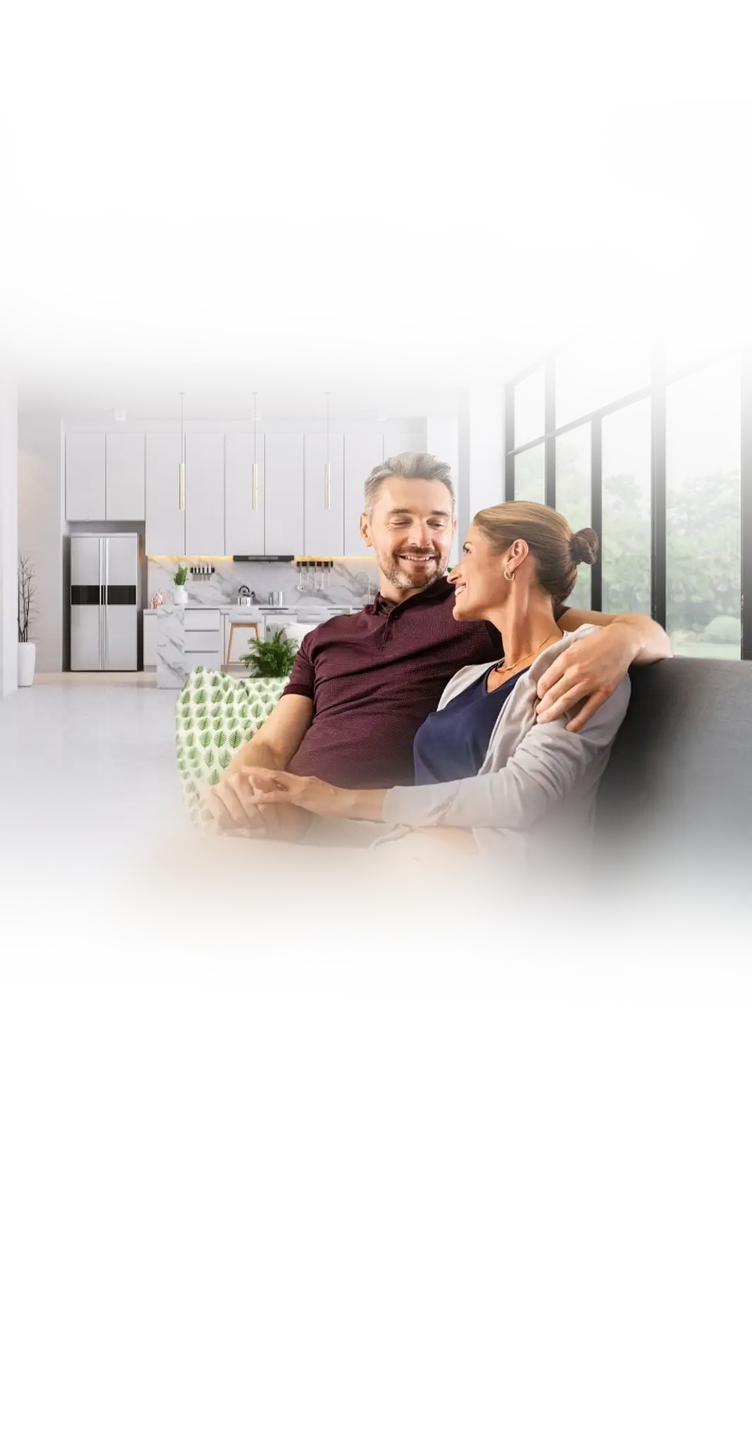 A relaxed couple enjoying their freshly painted, light-filled living room